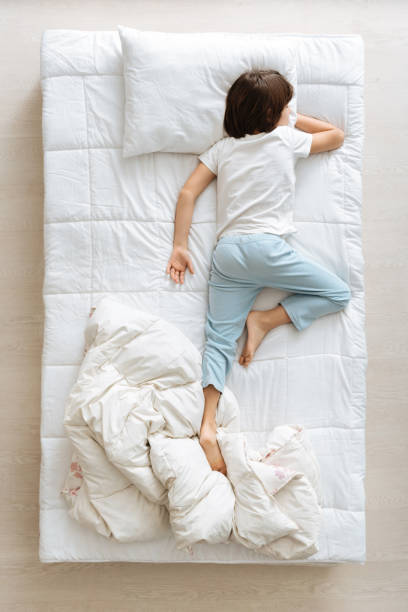 istock Exhausted cute boy lying on his belly 667801756