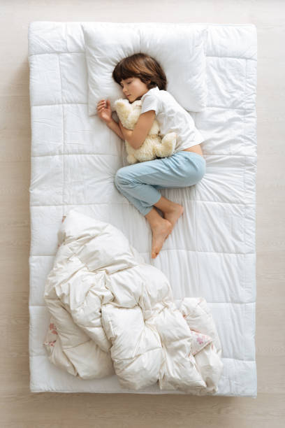 istock Adorable young boy resting with his toy 667801856