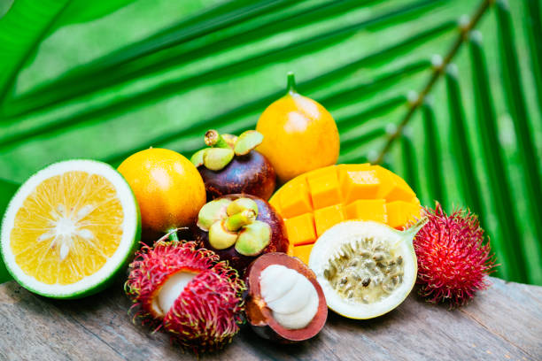 istock Exotic fruits on the wooden table 667802382