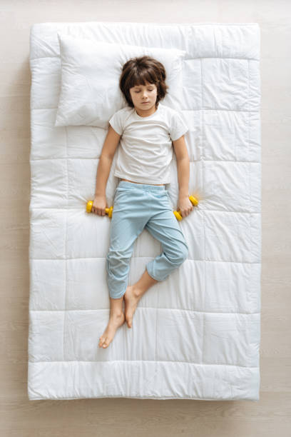 istock Lazy cute boy having a nap in the morning 667802738