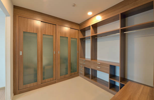 istock wooden carbinets in dressing room in modern home, interior design 667806280
