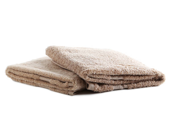 istock Beige towel isolated on a white background 667809788