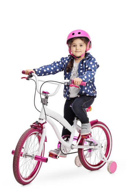 cute little girl on a bike - helmet bicycle little girls child imagens e fotografias de stock
