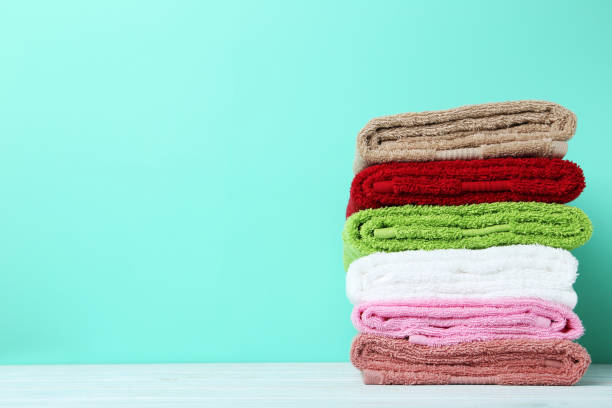 istock Colorful towels on green background 667816356