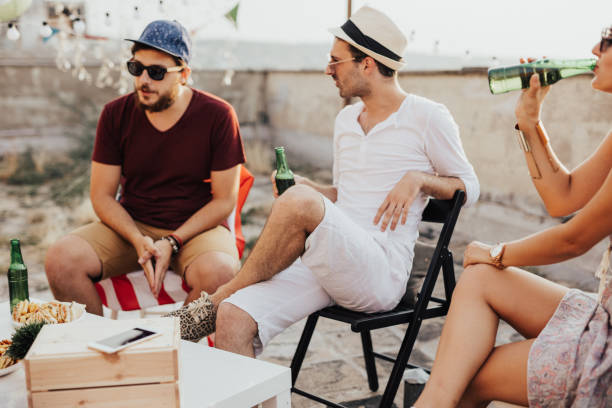 istock Group of people chilling on the rooftop 667822910