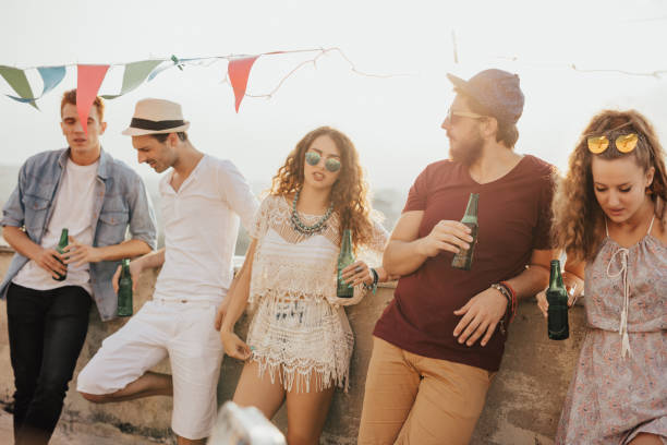 istock Group of people chilling on the rooftop 667823148