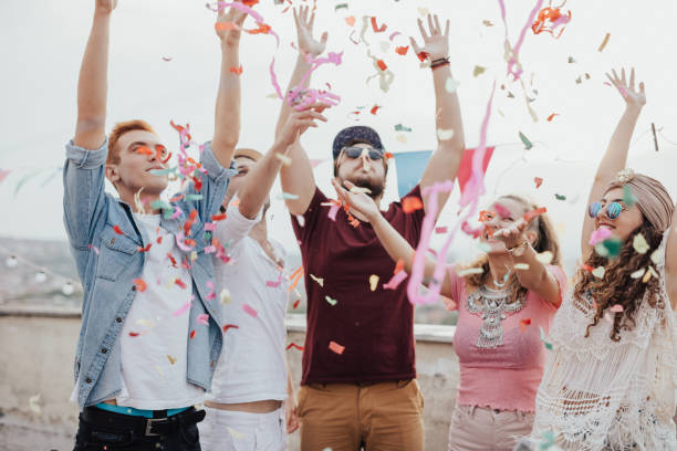 istock Group of friends going wild with confetti's 667824086