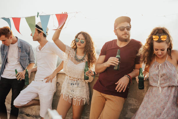 istock Group of friends chilling on the rooftop 667824304