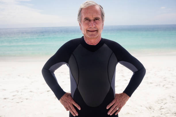 istock Portrait of senior man standing with hands on hips 667824712