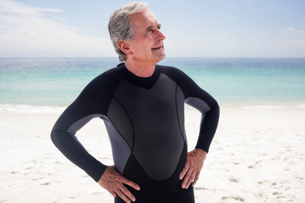 istock Happy senior man standing with hands on hips 667825120