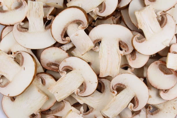 istock fresh mushroom slices food background texture 667828626