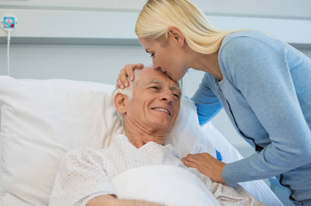 daughter kissing senior father - visit hospital patient senior adult imagens e fotografias de stock