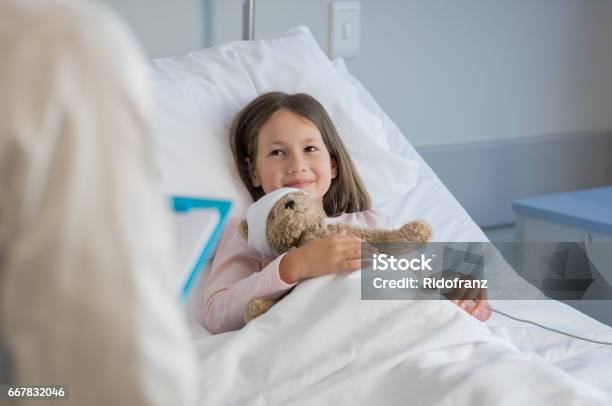 Cute Girl At Hospital Stock Photo - Download Image Now - Hospital, Child, Bed - Furniture