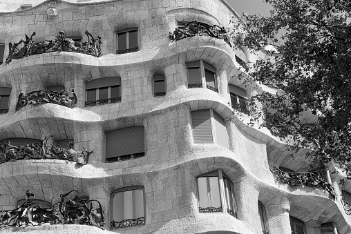 Barcelona, Spain - July 12, 2016: Barcelona (Catalunya, Spain): house Mila, or Pedrera, famous building by Gaudi along the Paseig de Gracia. Black and white