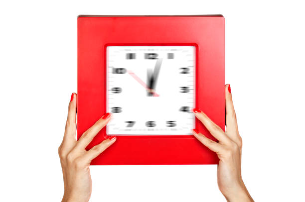 il tempo passa rapidamente, controllando l'ora - clock time clock hand urgency foto e immagini stock