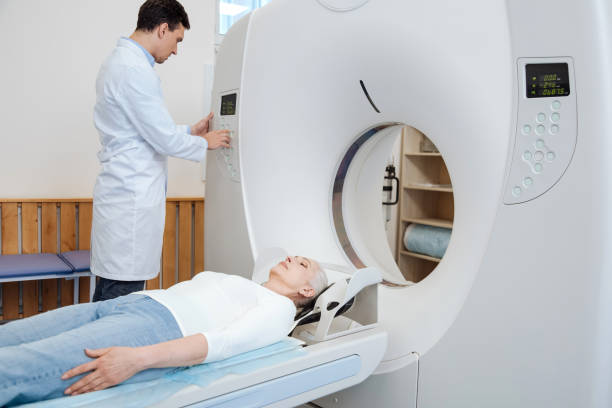 istock Serious male doctor using MRI scanner 667853436