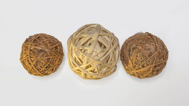 istock Three decorative wicker wooden balls, white background 667853596