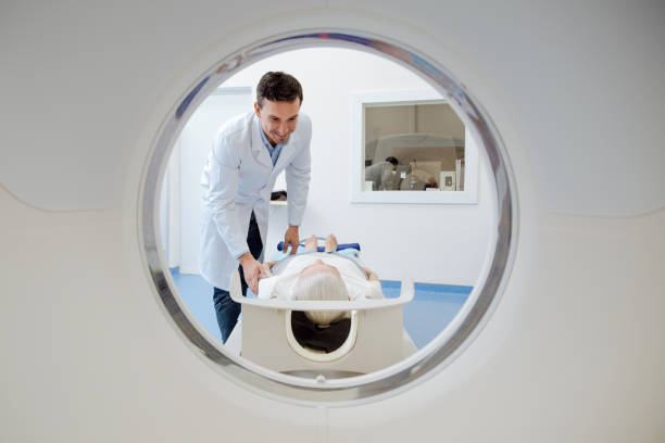 istock Delighted joyful doctor leaning over his patient 667853858