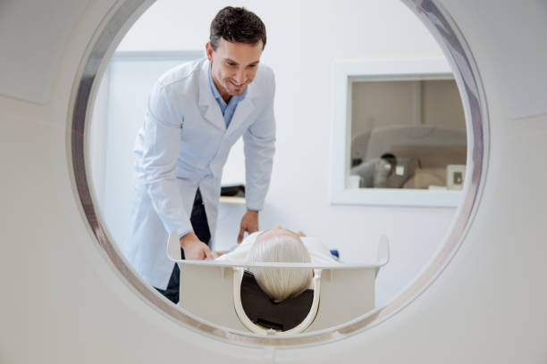 istock Joyful handsome doctor cheering his patient up 667853956