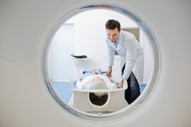 istock Positive happy doctor looking at his patient 667854264