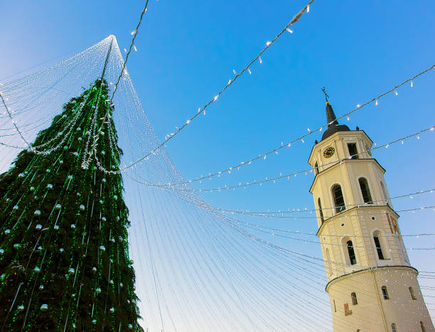 istock Christmas tree and Cathedral bell tower Vilnius Advent evening 667859330