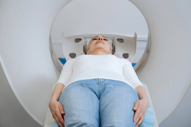 istock Serious worried patient lying on the examination table 667865124