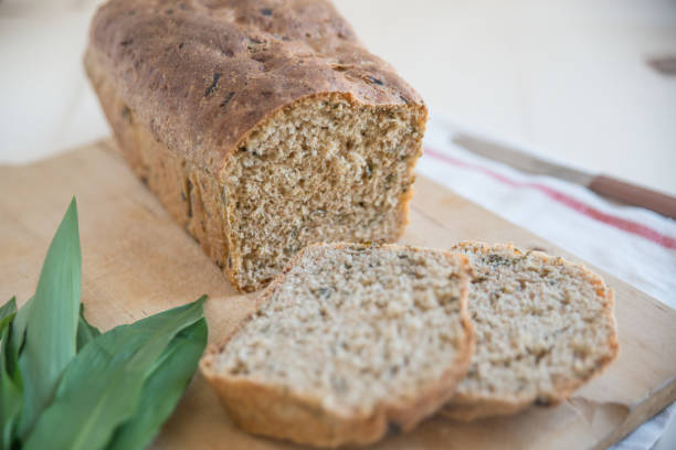 istock Loaf of bread with wild garlic 667865196