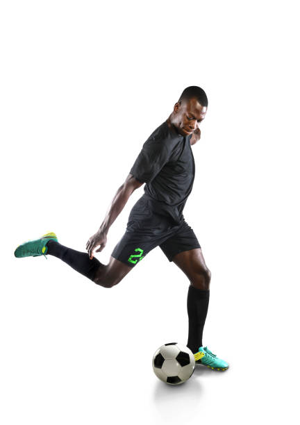 istock African American Soccer Player Kicking Ball 667870456