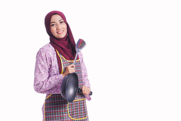 istock Housewife wear an apron hold cooking tools with different body language and face expression isolated on white background - kitchen, family and lifestyle concept 667870598