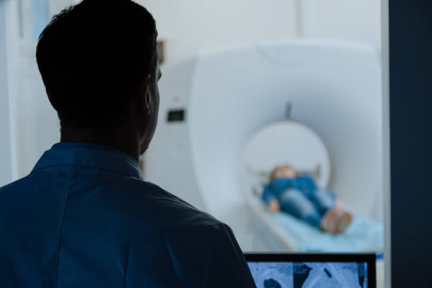 istock Nice male doctor observing his patient 667871006