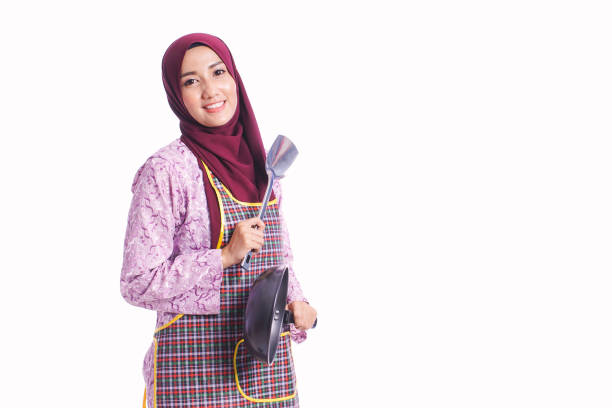 istock Housewife wear an apron hold cooking tools with different body language and face expression isolated on white background - kitchen, family and lifestyle concept 667871090