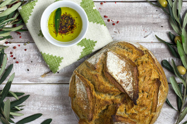 istock Whole bread with olive oil flat lay 667873464