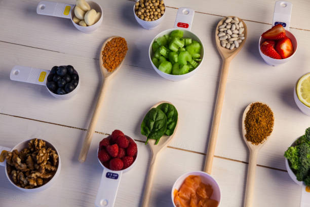 istock Portion cups and spoons of healthy ingredients 667874532