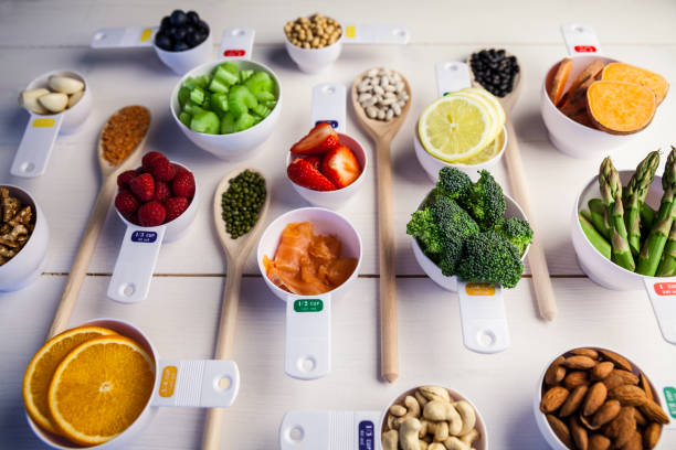 istock Portion cups and spoons of healthy ingredients 667878092
