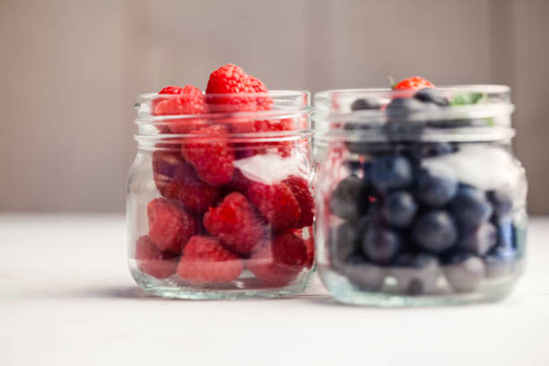 istock Glass jars of fresh berries 667879688