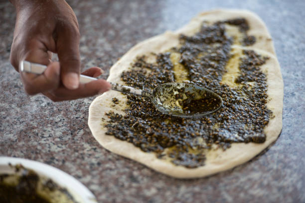 istock Preparation pita bread with Za'atar spice. 667884364