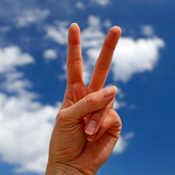 istock hand showing victory sign 667888852