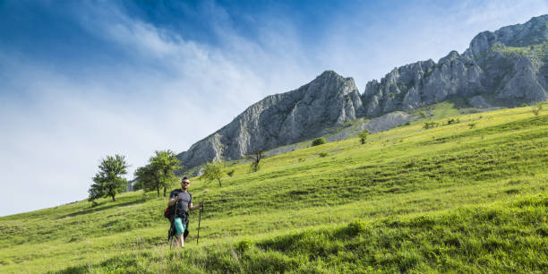 istock Young Man Hiking in Mountains 667890132