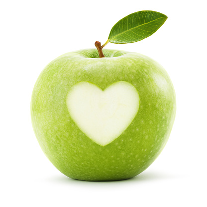 Granny smith apple with leaf and heart symbol isolated on white background. Clipping path included.