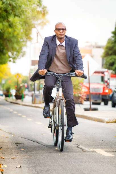 istock Single black male in his 30s commuting to work by bicycle 667894978