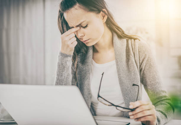 istock Young woman is tired and feels stressed out. 667895042