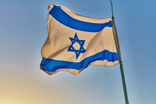 istock Israel flag at sunset 667899524
