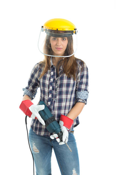 istock Attractive young woman builder with drill tool 667899918