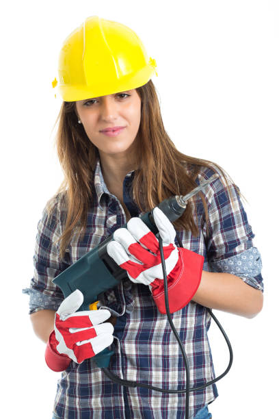 istock Attractive young woman builder with drill tool 667903332