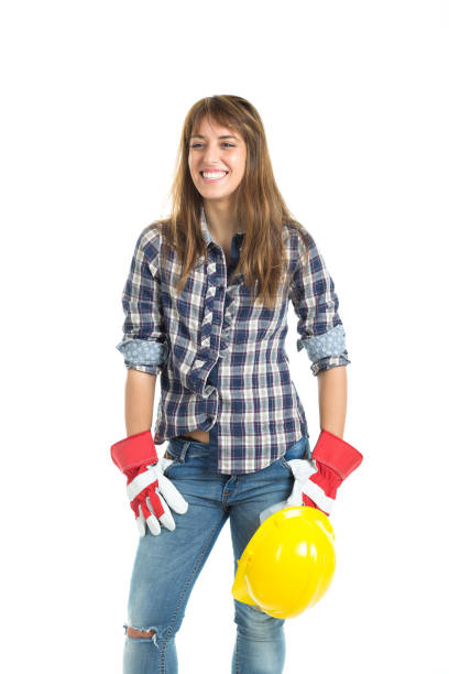 istock Attractive young woman builder with helmet and work glove 667904460