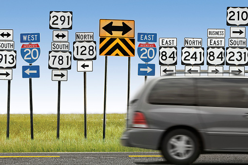 Nashville, USA - Daytime traffic on Interstate 40 as it approaches Nashville, with signs for upcoming freeway exits.