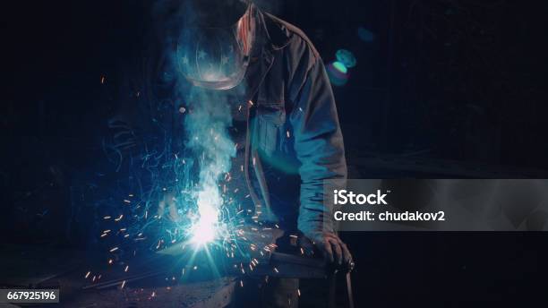 Smith Welding Metal Details Stock Photo - Download Image Now - Black Background, Blacksmith, Adult