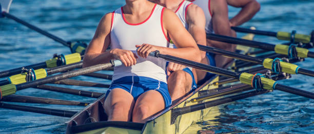 four men in a rowboat - rowboat sport rowing team sports race imagens e fotografias de stock