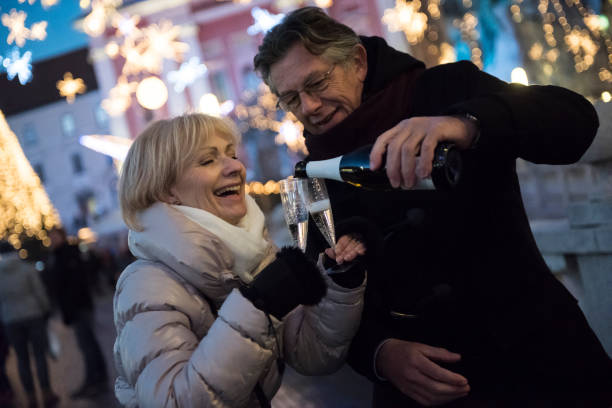istock Mature couple toasting with champagne 667929866