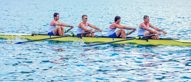 sport rowing on a lake - rowboat sport rowing team sports race imagens e fotografias de stock